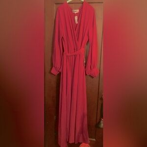 Elegant fuchsia long-sleeve dress.